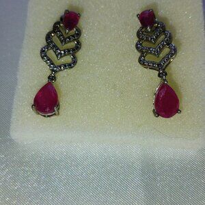 Ruby dangling earrings in sterling silver
